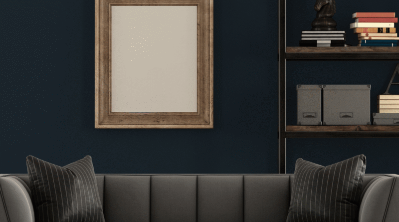 Soggiorno elegante e luminoso con divano grigio scuro, arredi moderni e dettagli raffinati in stile contemporaneo.